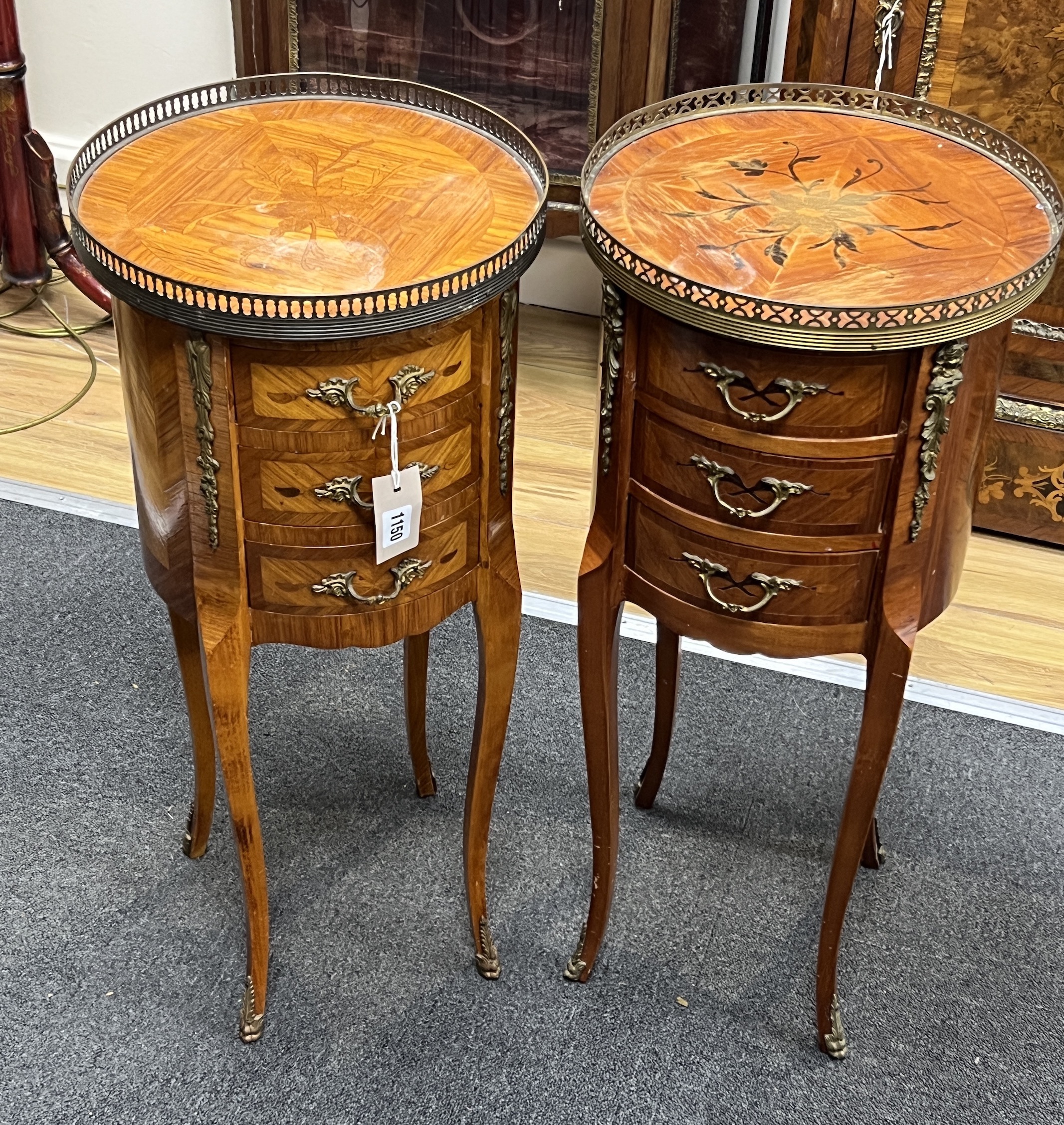 A pair of marquetry inlaid circular kingwood bedside chests, diameter 32cm, height 73cm